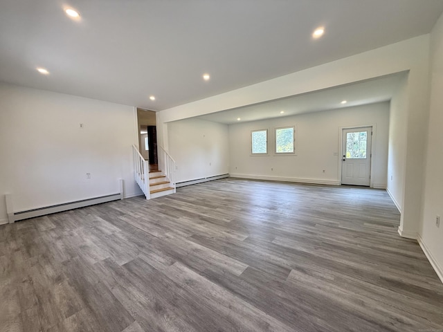 249 Wall St, Hebron, CT 06248 - unfurnished living room featuring a baseboard radiator, a baseboard heating unit, recessed lighting, stairway, and wood finished floors