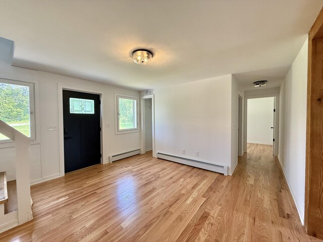 249 Wall St, Hebron, CT 06248 - foyer with baseboard heating and light wood-type flooring