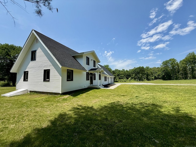 249 Wall St, Hebron, CT 06248 - view of side of property with a yard and roof with shingles