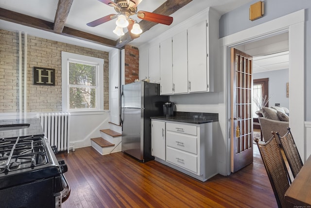29 Circuit Ave, Waterbury, CT 06708 - kitchen featuring freestanding refrigerator, radiator, dark wood finished floors, white cabinetry, and ceiling fan
