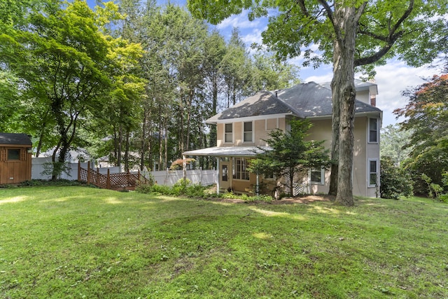 29 Circuit Ave, Waterbury, CT 06708 - rear view of house with stucco siding and a chimney