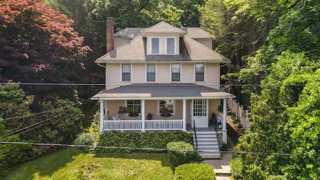 29 Circuit Ave, Waterbury, CT 06708 - american foursquare style home with a porch, a chimney, a forest view, stucco siding, and roof with shingles