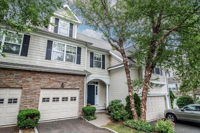6 Faith Ln Unit 6, Danbury, CT 06810 - traditional-style home with stone siding, driveway, and an attached garage