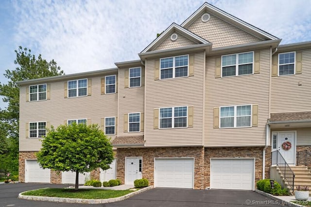 3 Riverview Ct Unit 3, Brookfield, CT 06804 - multi unit property with driveway, a garage, and stone siding