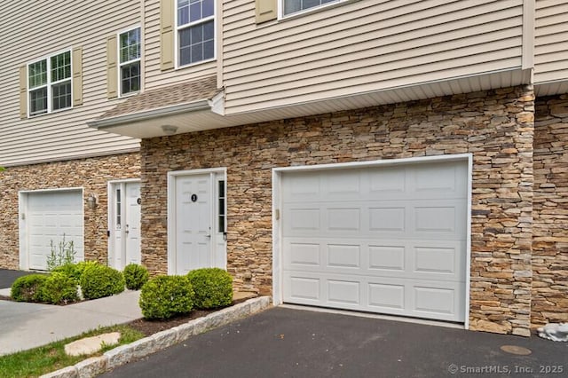 3 Riverview Ct Unit 3, Brookfield, CT 06804 - entrance to property with stone siding, driveway, and an attached garage