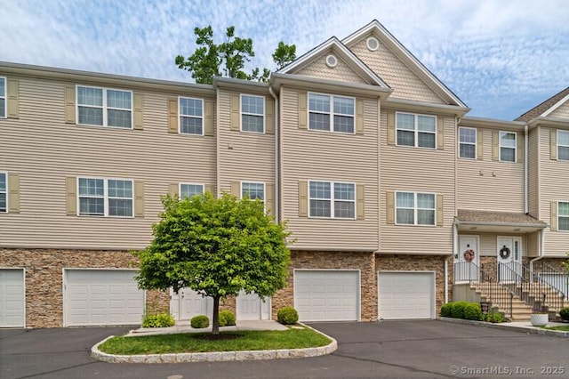 3 Riverview Ct Unit 3, Brookfield, CT 06804 - townhome / multi-family property with driveway, a garage, and stone siding