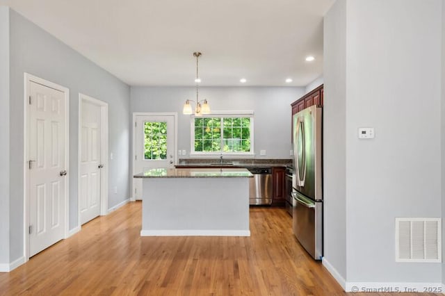 3 Riverview Ct Unit 3, Brookfield, CT 06804 - kitchen featuring appliances with stainless steel finishes, a kitchen island, light wood finished floors, recessed lighting, and decorative light fixtures