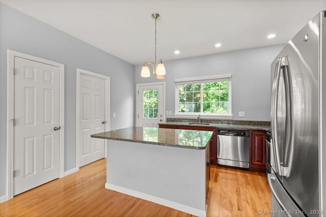 3 Riverview Ct Unit 3, Brookfield, CT 06804 - kitchen featuring appliances with stainless steel finishes, light wood-style floors, a center island, decorative light fixtures, and recessed lighting