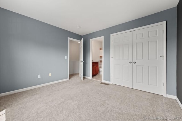 3 Riverview Ct Unit 3, Brookfield, CT 06804 - unfurnished bedroom with light carpet, a closet, and ensuite bath