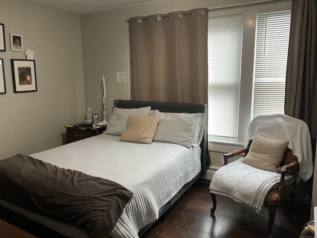 140 Stuart Ave, Norwalk, CT 06850 - bedroom with dark wood-style flooring and a baseboard heating unit