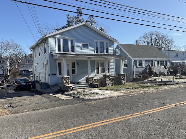 140 Stuart Ave, Norwalk, CT 06850 - view of front of property with a porch and a chimney