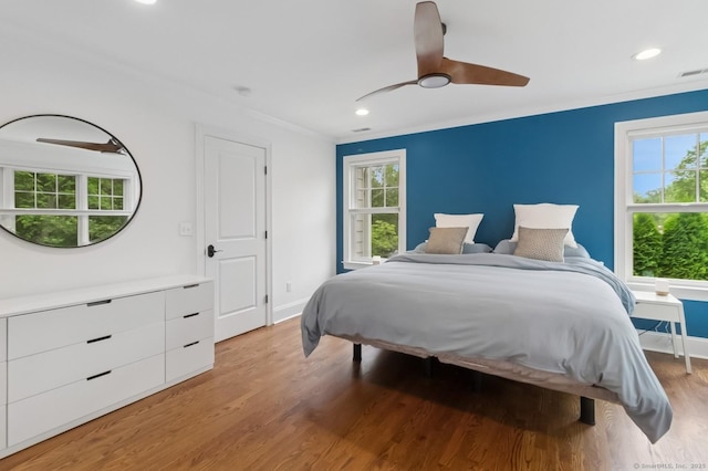 109 W Ave, Darien, CT 06820 - bedroom with light wood finished floors, multiple windows, recessed lighting, ornamental molding, and ceiling fan