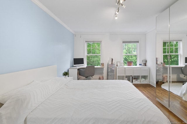 109 W Ave, Darien, CT 06820 - bedroom with ornamental molding, wood finished floors, a desk, and rail lighting