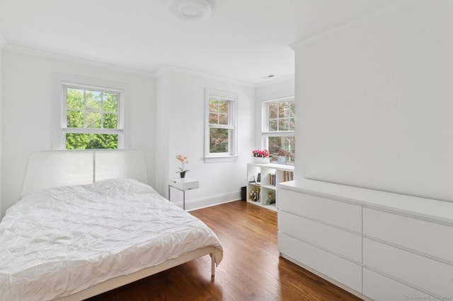 109 W Ave, Darien, CT 06820 - bedroom with crown molding, multiple windows, and wood finished floors