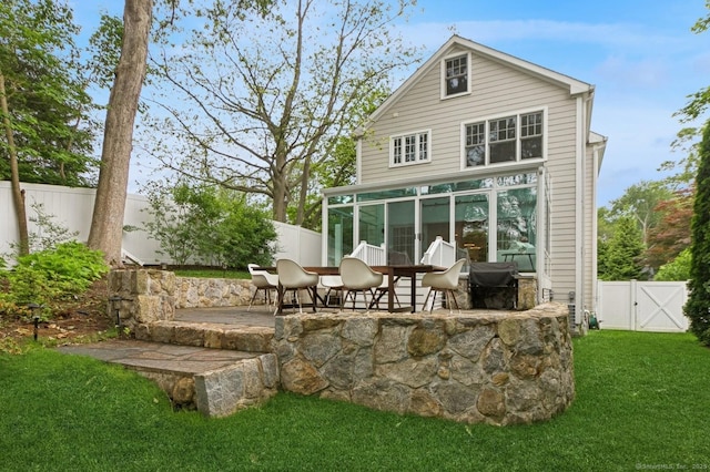 109 W Ave, Darien, CT 06820 - back of house featuring a fenced backyard, a patio area, a gate, and a sunroom