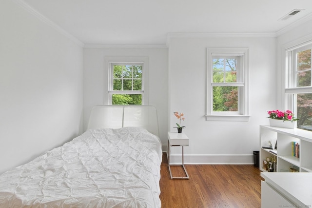 109 W Ave, Darien, CT 06820 - bedroom featuring wood finished floors, multiple windows, and ornamental molding