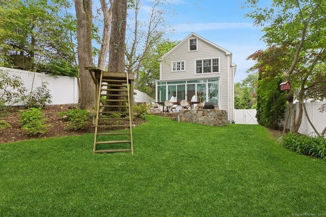 109 W Ave, Darien, CT 06820 - back of property with a fenced backyard, stairs, a sunroom, and a gate