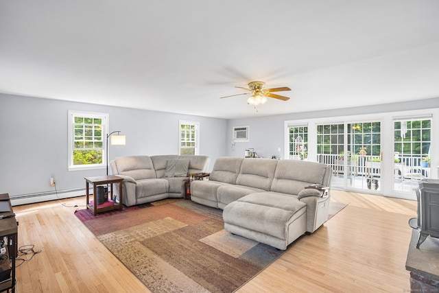 97 Wildwood Cir, Durham, CT 06422 - living area featuring a baseboard radiator, light wood finished floors, ceiling fan, and a wall mounted AC