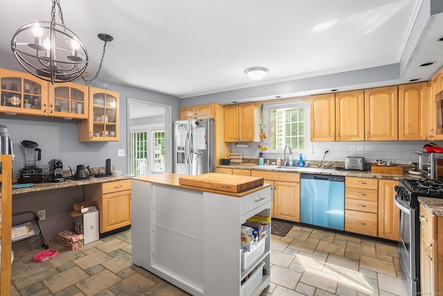 97 Wildwood Cir, Durham, CT 06422 - kitchen featuring stainless steel appliances, stone tile flooring, plenty of natural light, and a kitchen island