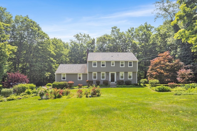97 Wildwood Cir, Durham, CT 06422 - colonial house featuring a front lawn and a chimney