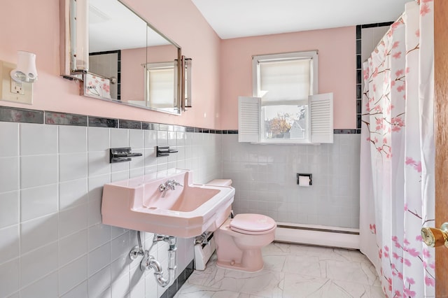 165 Douglas St, Stratford, CT 06614 - full bathroom featuring a baseboard heating unit, tile walls, marble finish flooring, curtained shower, and wainscoting