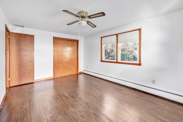 165 Douglas St, Stratford, CT 06614 - unfurnished bedroom featuring a baseboard heating unit, wood finished floors, a closet, and ceiling fan