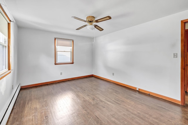 165 Douglas St, Stratford, CT 06614 - unfurnished room with a baseboard heating unit, a ceiling fan, plenty of natural light, and wood finished floors