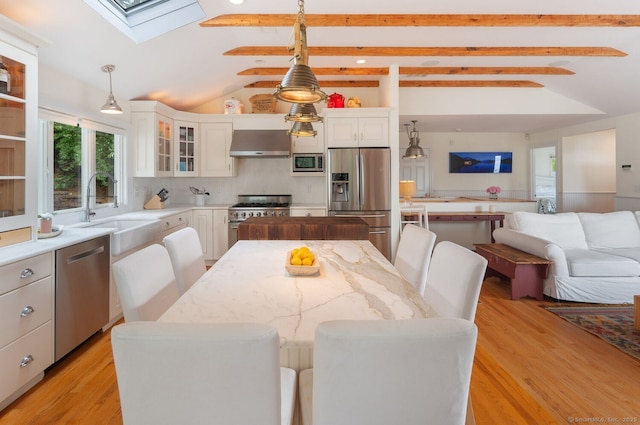 113 N Lake Shore Dr, Brookfield, CT 06804 - dining space with a skylight and light wood-style flooring