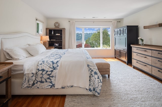 113 N Lake Shore Dr, Brookfield, CT 06804 - bedroom featuring multiple windows and wood finished floors