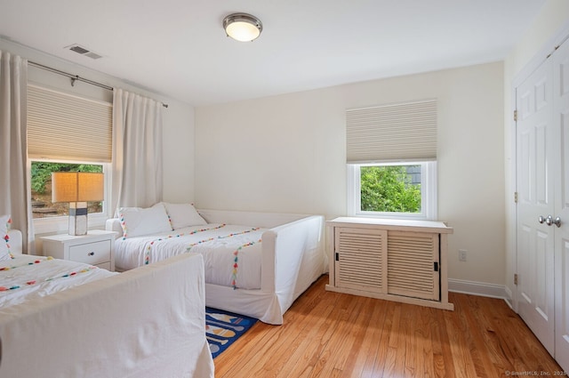 113 N Lake Shore Dr, Brookfield, CT 06804 - bedroom with light wood-style flooring and a closet