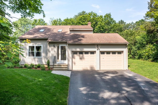 52 Crooked Trl, Woodstock, CT 06281 - view of front of house featuring driveway, a garage, a chimney, and a front yard