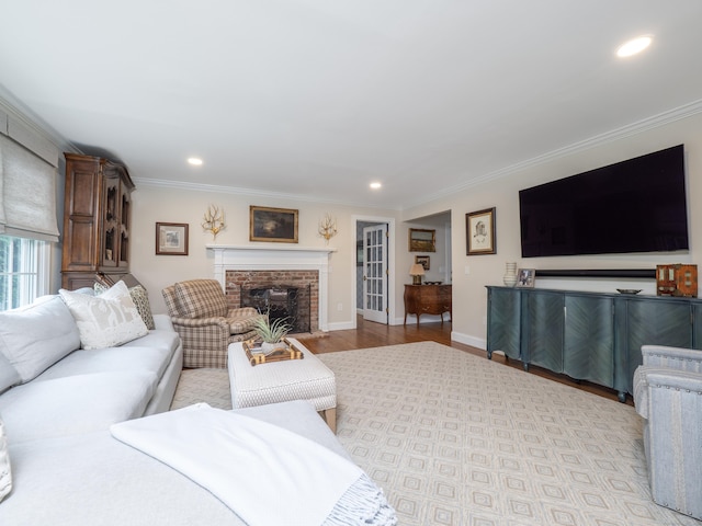 120 Prospect St Apt 63, Ridgefield, CT 06877 - living area featuring crown molding, wood finished floors, a brick fireplace, and recessed lighting