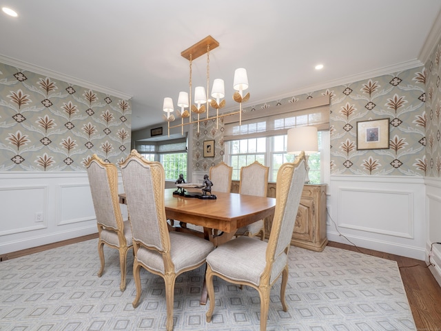 120 Prospect St Apt 63, Ridgefield, CT 06877 - dining space featuring wallpapered walls, crown molding, a decorative wall, a chandelier, and light wood-type flooring