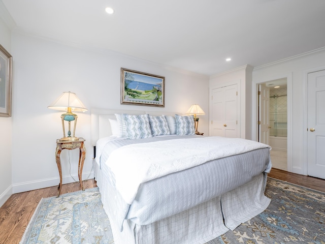 120 Prospect St Apt 63, Ridgefield, CT 06877 - bedroom with wood finished floors, ornamental molding, recessed lighting, and connected bathroom