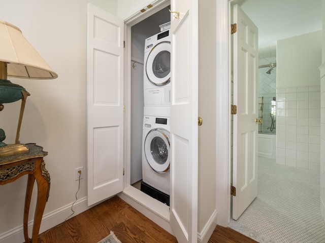 120 Prospect St Apt 63, Ridgefield, CT 06877 - laundry area with estacked washer and dryer and dark wood-type flooring