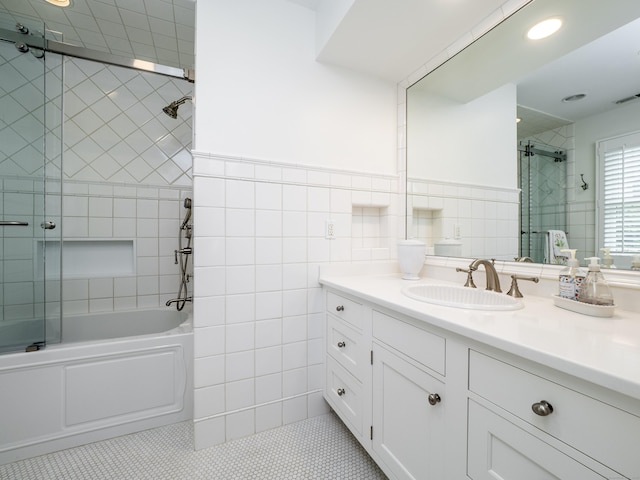 120 Prospect St Apt 63, Ridgefield, CT 06877 - full bath with vanity, tile patterned flooring, tile walls, bath / shower combo with glass door, and recessed lighting