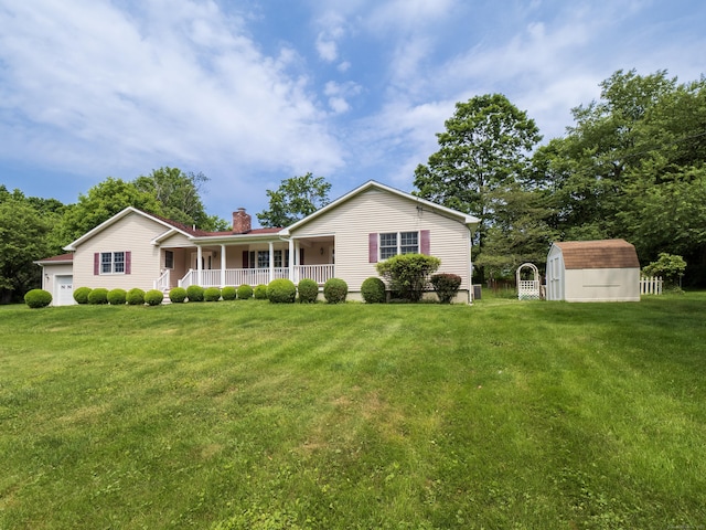 11 Scodon Dr, Ridgefield, CT 06877 - view of front facade with covered porch, a shed, a chimney, a front lawn, and an attached garage