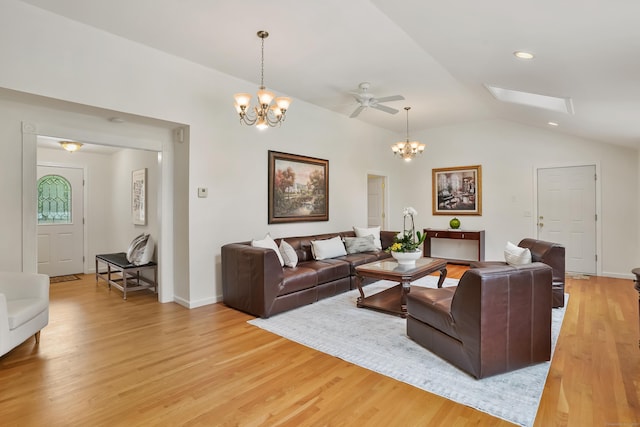 11 Scodon Dr, Ridgefield, CT 06877 - living area with a chandelier, light wood finished floors, lofted ceiling, a skylight, and recessed lighting