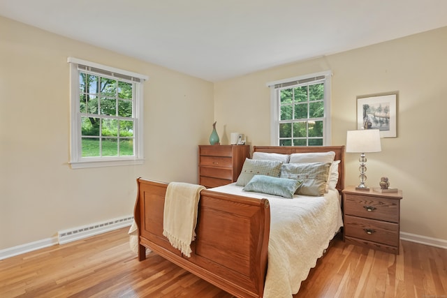 11 Scodon Dr, Ridgefield, CT 06877 - bedroom with baseboard heating and wood-type flooring