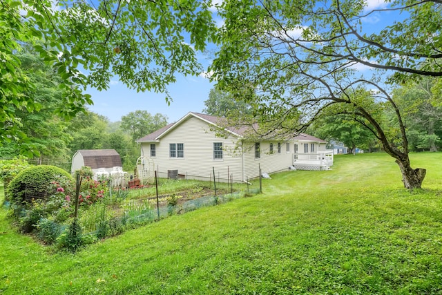 11 Scodon Dr, Ridgefield, CT 06877 - view of grassy yard featuring a shed and a deck