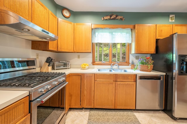 348 State Route 39, New Fairfield, CT 06812 - kitchen with stainless steel appliances, ventilation hood, light countertops, and light tile patterned flooring