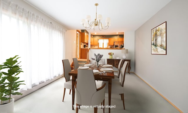 348 State Route 39, New Fairfield, CT 06812 - dining space with a chandelier and light carpet