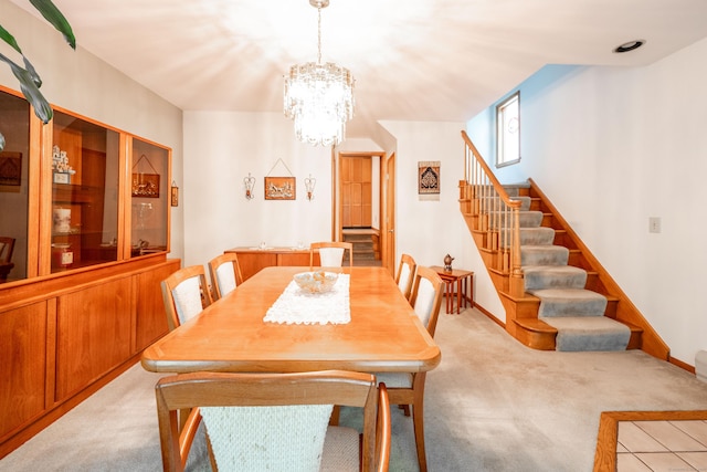 348 State Route 39, New Fairfield, CT 06812 - dining area featuring stairs, carpet, and a chandelier
