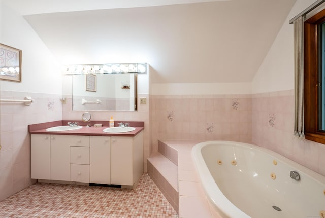 348 State Route 39, New Fairfield, CT 06812 - full bath with double vanity, a tub with jets, lofted ceiling, tile walls, and tile patterned flooring
