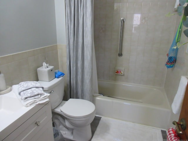 75 Wheeler Ave Unit 205, Bridgeport, CT 06606 - bathroom featuring shower / tub combo with curtain, tile walls, vanity, and wainscoting