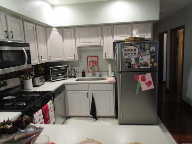 75 Wheeler Ave Unit 205, Bridgeport, CT 06606 - kitchen with appliances with stainless steel finishes and light countertops