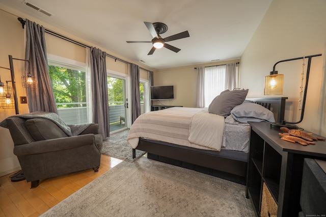 267 Melba St Apt B13, Milford, CT 06460 - bedroom with access to outside, light wood-style flooring, and a ceiling fan