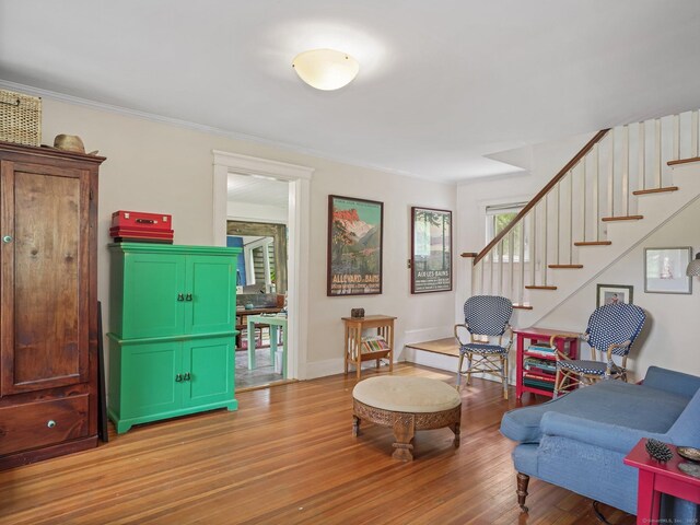 58 Riverdale Ave, Greenwich, CT 06831 - living room featuring stairway, wood finished floors, and ornamental molding