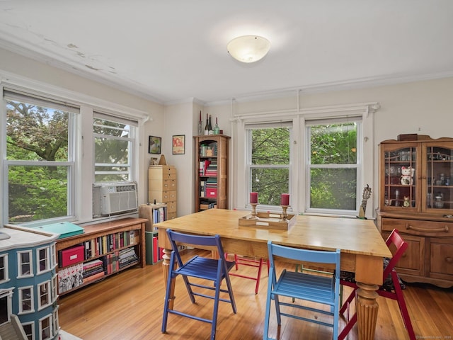 58 Riverdale Ave, Greenwich, CT 06831 - dining space with wood finished floors, ornamental molding, healthy amount of natural light, and cooling unit