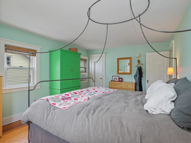 58 Riverdale Ave, Greenwich, CT 06831 - bedroom with light wood-style floors and baseboards